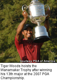 Tiger Woods hoists the Wanamaker Trophy after winning his 13th major at the 2007 PGA Championship.