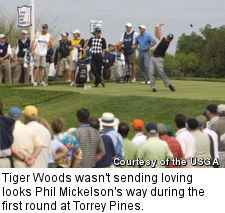 Tiger Woods wasn't sending loving looks Phil Mickelson's way during the first round at Torrey Pines.