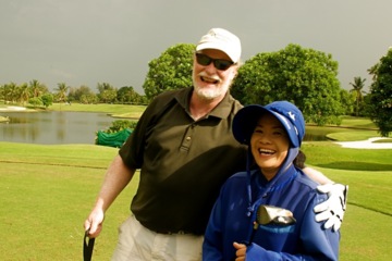 Golfer and Thai caddie